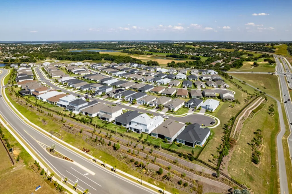 Aerial view of a planned residential neighborhood and the surrounding road network